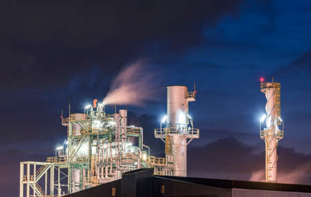 Petrochemical plant under dark skyの写真素材