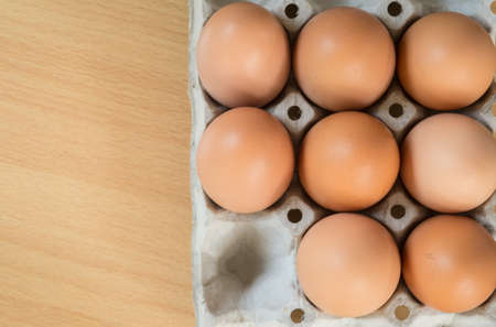 Eggs in paper tray, Top view.