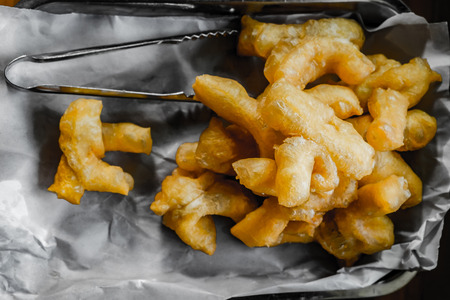 Patongko/youtiao or deep fried doughstick. also known as the Chinese cruller, Chinese oil stick, Chinese doughnut, You Char Kway. Top view. Selective Focus.の写真素材