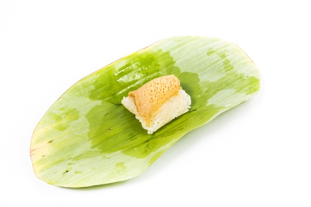 Thailand dessert.Sticky rice Steamed custard and  Sticky rice Fish.Thailand dessert wrapped in banana leaves isolated on white backgroundの写真素材