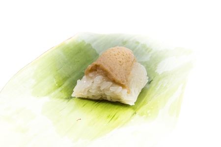 Thailand dessert.Sticky rice Steamed custard and  Sticky rice Fish.Thailand dessert wrapped in banana leaves isolated on white backgroundの写真素材