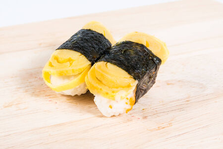 Sushi eggs on wooden floors.の写真素材