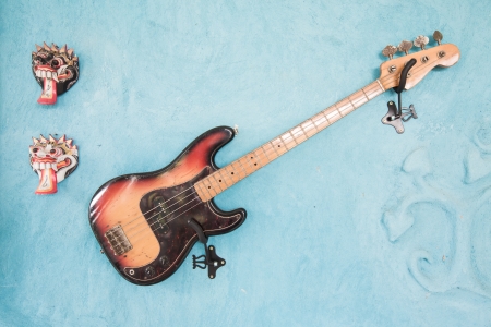 Bass guitar on the wall blue.の写真素材