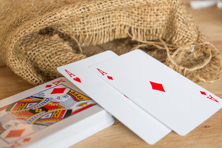 poker double A sack on  background wood.
