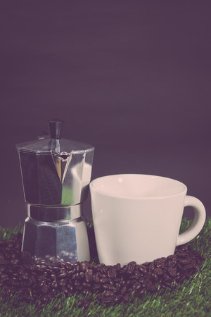 vintage coffee pot and coffee beans.の写真素材