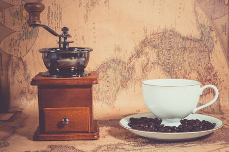 Coffee grinder  coffee cup on the mapの写真素材