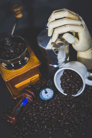 coffee grinder, coffee pot Clock Hourglass Alarm on Coffee beans. Coffee cup full of coffee beans.の写真素材