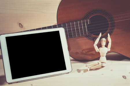 play guitar and composed songs using the tablet.の写真素材