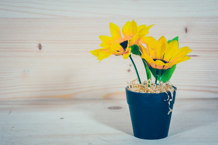 Sunflower in a Flowerpot On a wooden backgroundの写真素材