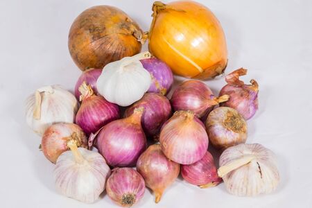 Onions and garlic, cooking machine On a white backgroundの写真素材