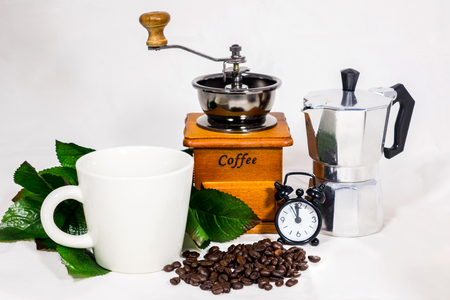 Coffee cup, alarm clock, coffee grinder and boiler, vintage on white backgroundの写真素材