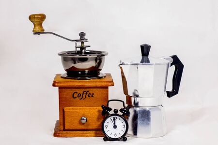 Alarm clock, coffee grinder and boiler, vintage on white background.の写真素材