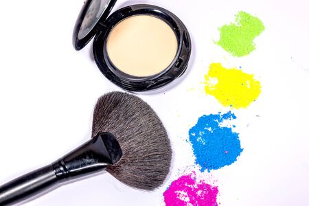 Colorful make-up with make-up brushes isolated on a white background.