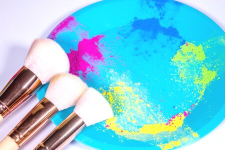 Colorful make-up with make-up brushes isolated on a white background.の写真素材