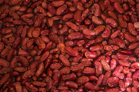 Red beans are boiled to cook food.の写真素材