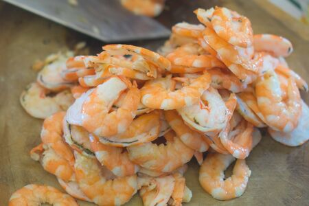 Two half-cut shrimp for cooking.の写真素材