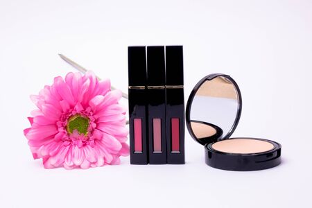 Flowers ,Powder and Liquid lipstick brush uses lips for women, isolated on white backgroundの写真素材