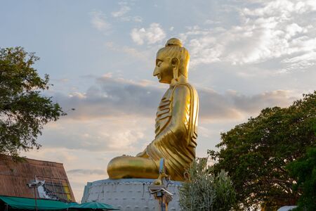 Golden Buddha statue, Buddha Kittisiri ChaiThe beautiful temple is located next to the sea. At Prachuap Khiri Khan in Thailandの写真素材