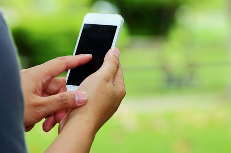 Hand are holding mobile phoneの写真素材