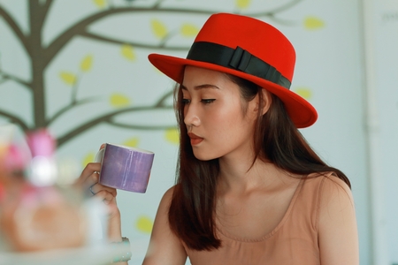 Asian women in coffee shopの写真素材