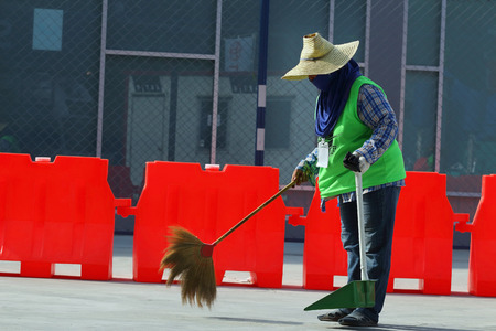 Buriram THAILAND - October 5: Cleaner sweeping the road to prepare for the Super GT race car 2014 at Chang International Circuit in Buriram United, on October 4-5, 2014 at the Buriram, Thailand.のeditorial素材