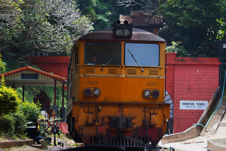 Lampang, Thailand-October 17: Trains are running through the Khun Tan Tunnel at Khun Tan Railway Station in  Lampang, Thailand on October 17, 2014のeditorial素材