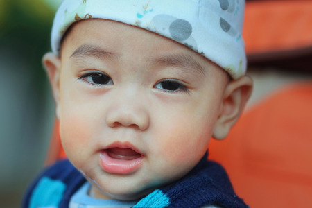 smiling asian baby, close-up