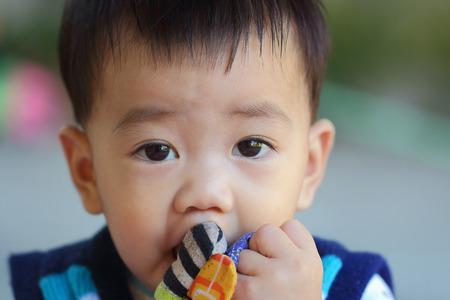 looked asian baby, close-upの写真素材