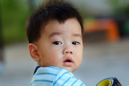 looked asian baby, close-upの写真素材