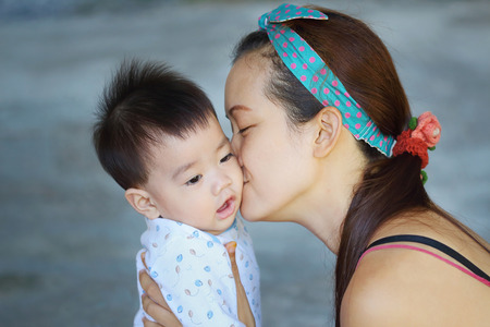 Mother kissing her babyの写真素材