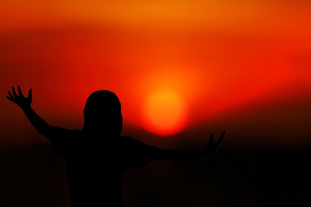 Women relaxing extend the arms in natural, silhouetteの写真素材