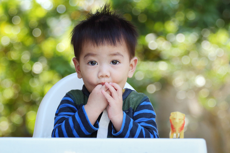 Close up asian baby look at camera, soft focusの写真素材