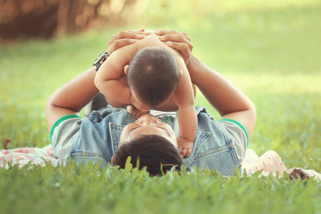 Asain family, asian baby girl was playing with her brother, they laughed happily.の写真素材