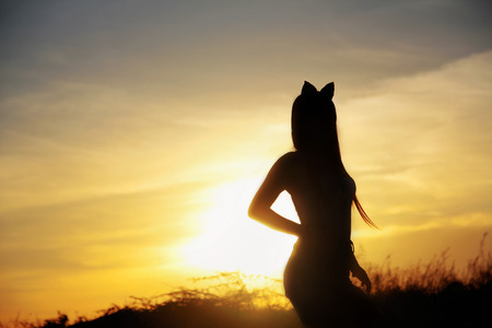 silhouette, Girl with a light evening twilight.の写真素材