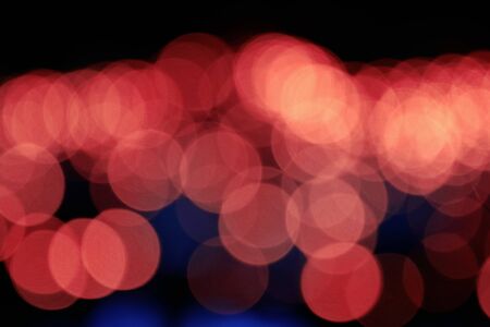 Bokeh beautiful red light in the darkness.