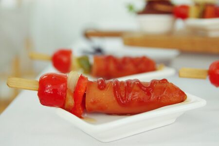 Barbecue sausages on white plate.の写真素材