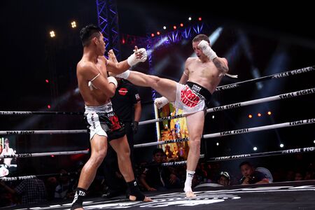 Nakhon Pathom, Thailand - November 21, 2015: Thai Boxer in World Muay Thai Fight 2015 King Cup. Semifinals at Royal Police Cadet Academy.のeditorial素材
