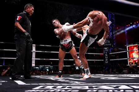 Nakhon Pathom, Thailand - November 21, 2015: Thai Boxer in World Muay Thai Fight 2015 King Cup. Semifinals at Royal Police Cadet Academy.のeditorial素材