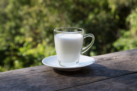 hot milk on the table and blurred backgroundの写真素材