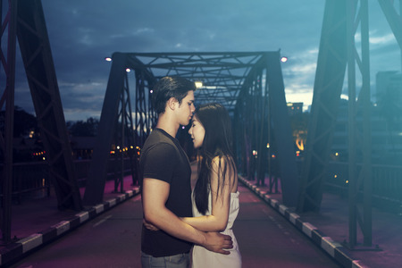 Young couple in love, hug and kissingの写真素材