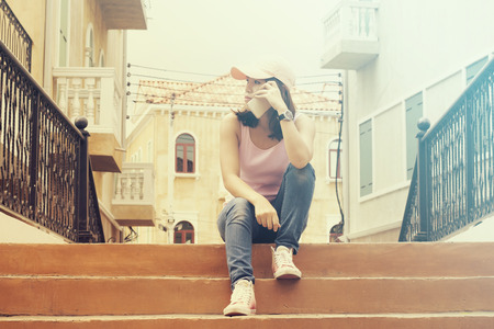 Asian woman calling and talking on smartphone, vintage toneの写真素材