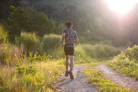 Running trail, Man running the trail in the morning.の写真素材
