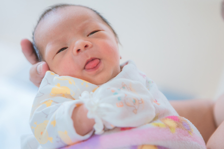Newborn asian baby asleepの写真素材