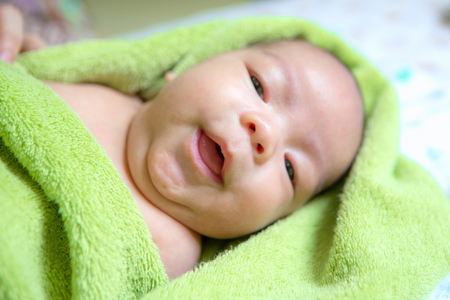 Newborn asian baby smileの写真素材