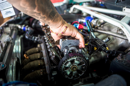 Mechanic checking the timing beltのeditorial素材