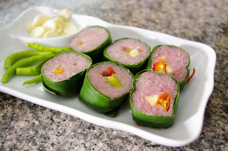 Thai traditional food fermented ground pork (Nham) with vegetable on white dishの写真素材