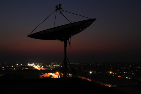 Satellite dish sky sun stars communication technology network image background for design sunsetの写真素材