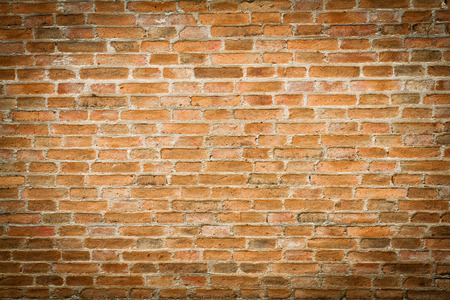 grunge background, red brick wall texture bright plaster wall and blocks road sidewalk abandoned exterior urban background for your concept or projectの写真素材