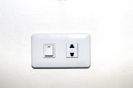 Close up of a wall light switch in the off positionの写真素材
