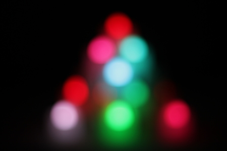 Abstract circular bokeh background of candlelight and Christmaslight on dark nightの写真素材